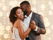 © Prostock-studio - Beautiful loving happy afro couple dancing in modern restaurant. Celebrating St Valentine's Day