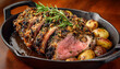 © Tata Design - Delicious lamb roast in pan on wooden board
