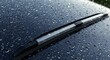 © Nurbaity - Car windshield with raindrops and wiper blade