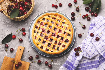 Wall Mural - tasty cherry pie and berries on grey textured table, flat lay