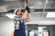 © Serhii - Hvac technician installing air conditioning ventilation system