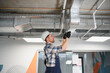 © Serhii - Hvac technician installing air conditioning and ventilation system