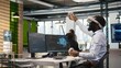 © DC Studio - Programmer wearing VR headset at office desk developing programs using AI automation. Startup worker using virtual reality technology, debugging applications with artificial intelligence, camera A