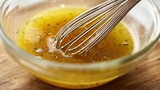 Whisking Salad Dressing: Close-Up of Homemade Vinaigrette