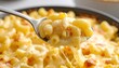 © bisa - Cheesy macaroni and cheese on a spoon