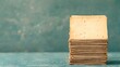 © Ravanas Arts - Stack of old faded papers on a textured background
