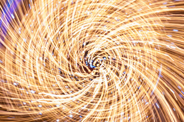 Wall Mural - Abstract swirl light trails on the dark background
