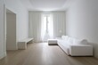 © Abuustman - Minimalist white living room with large window