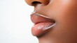 © vadosloginov - Young African American woman applying lip product in studio