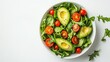 © vadosloginov - Healthy bowl of avocado, cherry tomatoes, and leafy greens