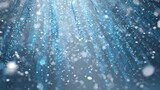 Water droplets fall from above, reflecting light in various shades of blue, creating a serene and peaceful ambiance. The gentle cascade evokes feelings of relaxation and rejuvenation.