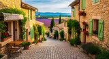 Photo of charming cobblestone street in a provencal village with lavender fields in the distance