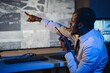 © Serhii - Serious African American security guard watching cctv video in surveillance room