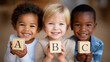 © ZaStock - Three children hold wooden letter blocks displaying A B C, beaming with joy in a cheerful setting. Warm, inviting atmosphere enhancing concepts of early education, child development, preschool