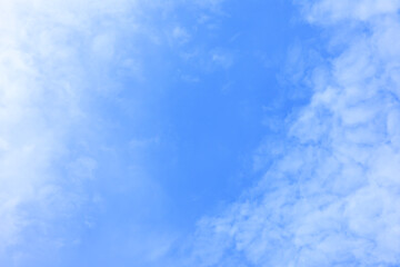Wall Mural - blue sky background and white clouds soft focus, space in the middle, horizontal shape.