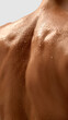 © master1305 - Close up of female muscular back with water drops on skin surface. Concept of body care, hygiene, wellness, medical examination, dermatology, and aesthetic treatment.
