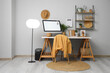 © Pixel-Shot - Stylish workplace with modern PC monitor and calendar near grey wall