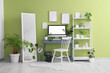 © Pixel-Shot - Interior of office with workplace, mirror and green plants