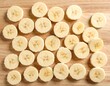 © XZIG IOVANS PRATAMA  - Sliced Bananas on Wooden Board A Fresh and Healthy Snack
