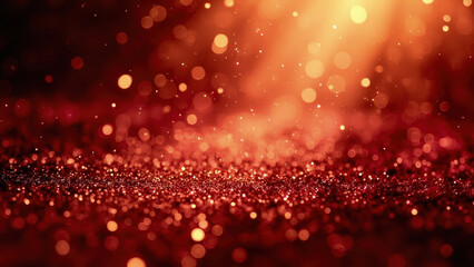 Abstract red and orange bokeh background with sparkling glitter particles and soft focus light effects creating a festive atmosphere