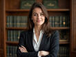 © dubogray1985 - A confident female lawyer stands with her arms crossed in a modern office.