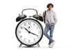 © Ljupco Smokovski - Young african american male student leaning on alarm clock