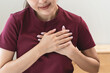 © Pormezz - Close-up woman touching chest feeling pain heart attack symptom