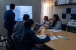 © Freeday photo - Team collaborates during a business meeting analyzing market trends and data in a modern office