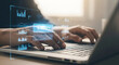 © KHYRUL - Person typing on laptop with futuristic data interface overlay