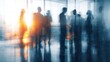 © frank - Blurred silhouettes of business people standing and conversing in an office with motion blur and sunlight filtering through windows, abstract dynamic business meeting atmosphere