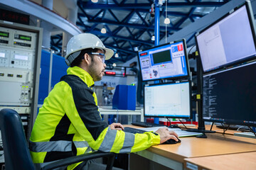 engineer working at control room,manager control system,technician man monitoring program from a lot