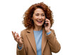 © Kakoli - Smiling woman with curly red hair talking on a smartphone gesturing with other hand transparent background