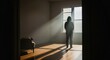 © Noer Aditia - Woman Silhouetted by Sunlight in Empty Room
