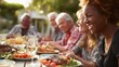 © Justlight - Happy senior friends enjoying a delightful meal together at an outdoor garden restaurant, sharing laughter, creating cherished memories, and celebrating the joys of friendship