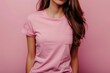 © nsit0108 - Close up of a young woman wearing a pink t shirt, showcasing a minimalist fashion style against a matching pink backdrop