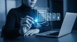 © ivatekstudio - Digital Policies: A person interacts with an augmented reality interface overlaying a laptop, symbolizing the modern approach to policy management and information processing.