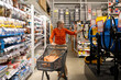 © Ivan Traimak - Woman shopping in hardware store for tools and home improvement supplies during daytime