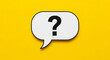 © PhotoArtHub - White speech bubble with black question mark on yellow background, showcasing uncertainty, inquiry, or a need for information, ideal for FAQ pages or help sections