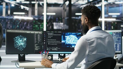 manager supervising data center engineer using ai neural network models to configure hardware. team 