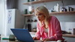 © stockbusters - Businesswoman loser reacting fail looking laptop screen at home cuisine closeup