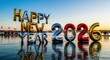 © ubooyys - 3D Happy New Year 2026 colorful sculpture on beach