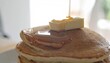 © art - Stack of fluffy pancakes with melting butter and flowing maple syrup for breakfast