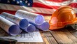 © Digistock - Construction blueprints and hard hat with American flag in the background