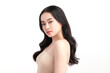 © kitthanes  - A beautiful young Asian woman with clean, fresh skin against a white background. Skincare, facial treatment, cosmetology, beauty, and spa. An elegant portrait of an Asian woman.