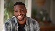 © Johannes - smiling cheerful young adult african american ethnicity man looking at camera standing at home office background happy confident black guy posing for headshot face front close up portrait no logos no