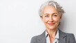 © Johannes - smiling beautiful mature business woman standing isolated on white background older senior businesswoman 60s grey haired lady professional female ceo coach looking at camera banner copy space no logo