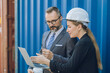 © Quality Stock Arts - Business manager team working in container yard, Shipping logistics business investor industry people.