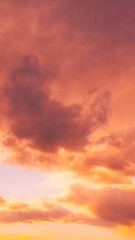 Wall Mural - Sunset Cloudy Sky With Fluffy Clouds. Sunset Sky in pink orange colors Background. Dramatic Sky. sunrise Sunset Time Lapse Time-Lapse In Yellow, Orange, Pink Colors