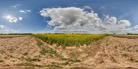 Wall Mural - hdri 360 panorama view on crossroads of gravel country roads among fields with clouds in sky in equirectangular full seamless spherical projection, ready for VR AR or sky dome replacement