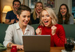 © ProArt Studios - Joyful Friends Celebrate an Exciting Online Milestone, as Two Women React Jubilantly to News on a Laptop